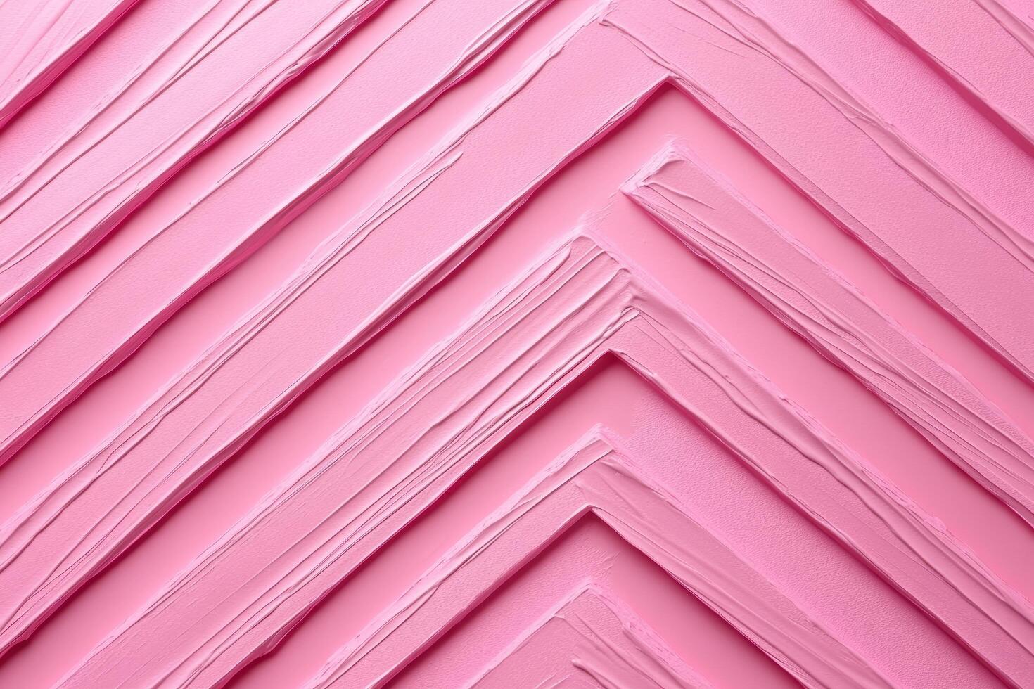 Textured pink background with diagonal lines created by paint photo