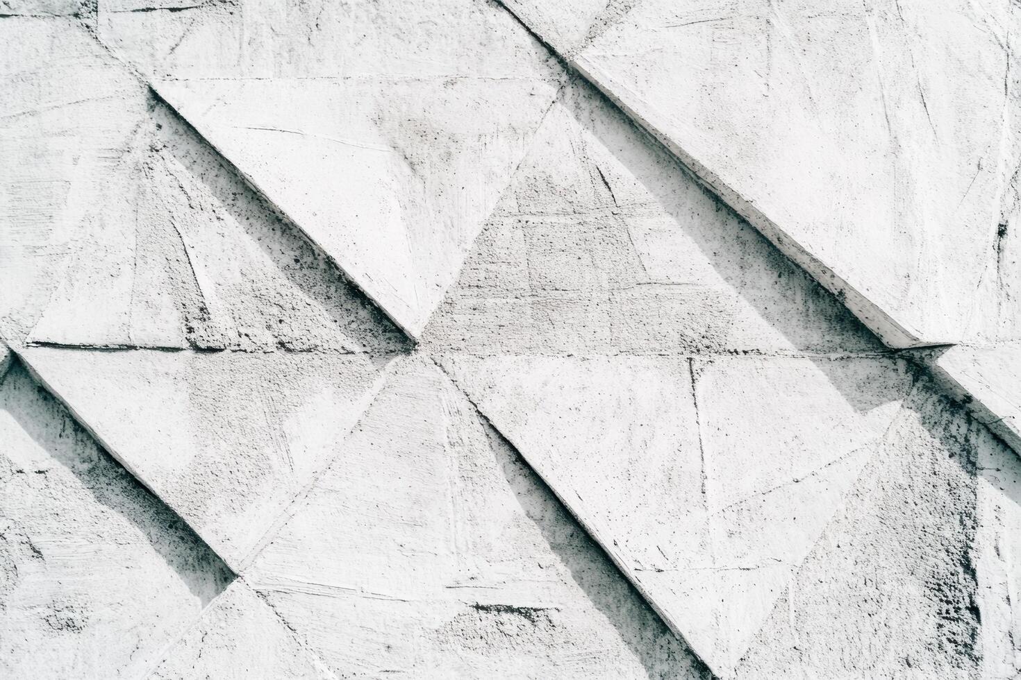 Unique textured wall featuring abstract triangular patterns in natural light photo