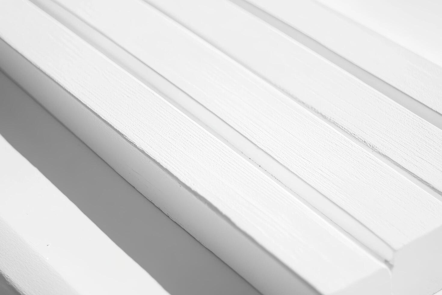 Close-up view of textured white wood surface with subtle lines and patterns photo