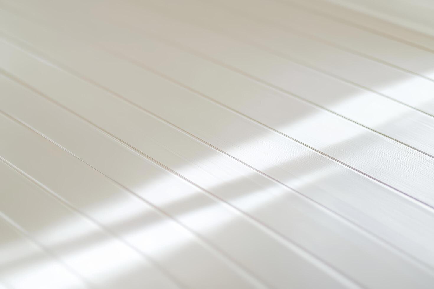 Light reflects on a white textured surface highlighting its patterns and lines photo