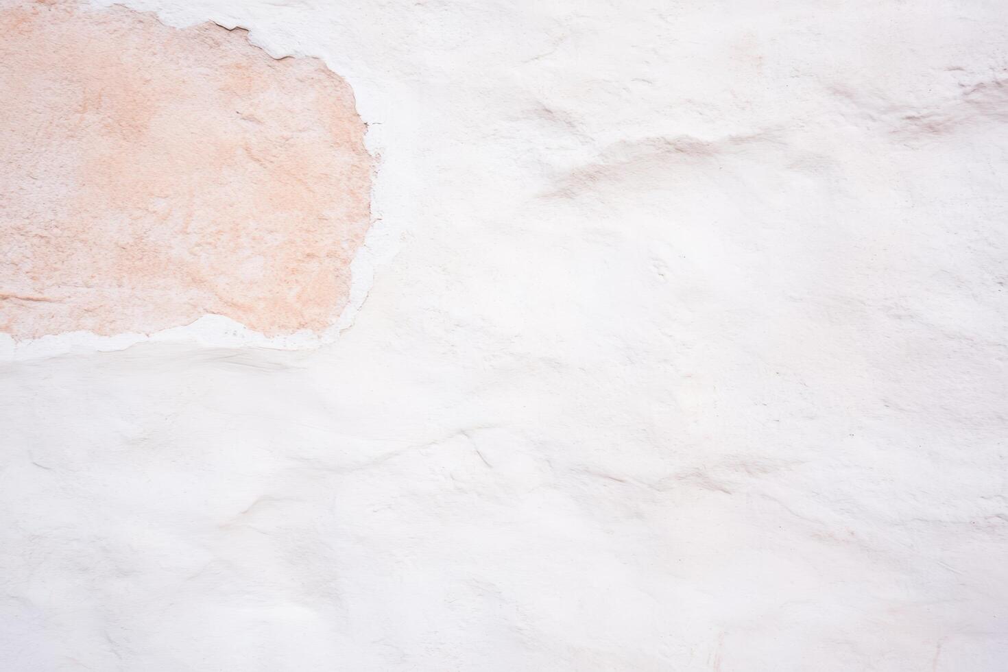 Textured wall with subtle color variations in a sunlit setting photo