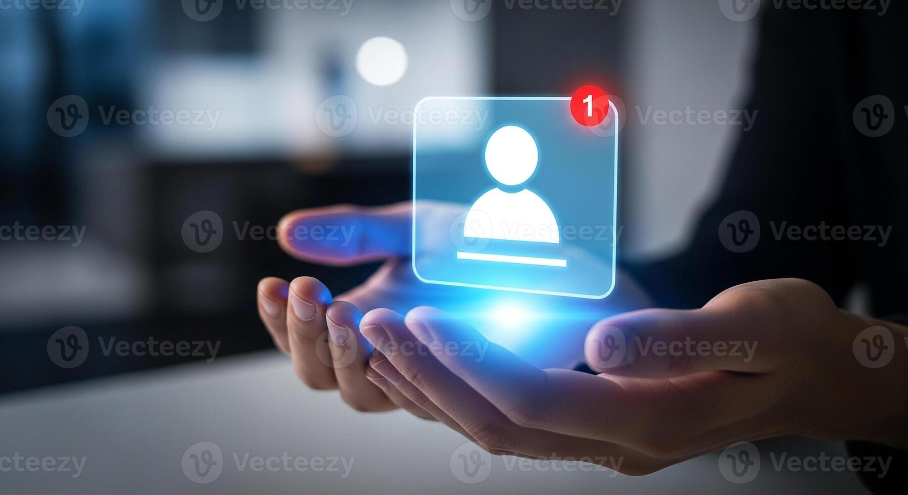 Person holding a glowing digital profile notification in hands, signifying new connection or message in modern office setting Represents networking, communication, and online inter photo