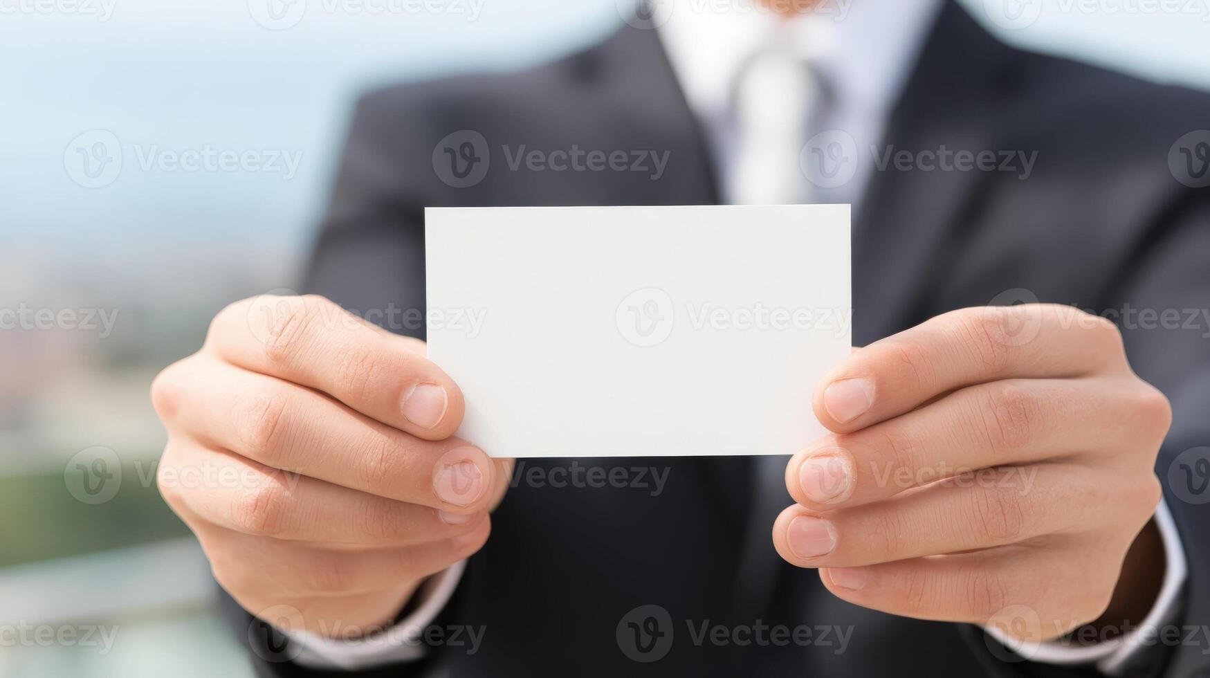 Professional Man Holding Blank Business Card in Suit and Tie, Ready for Custom Text photo