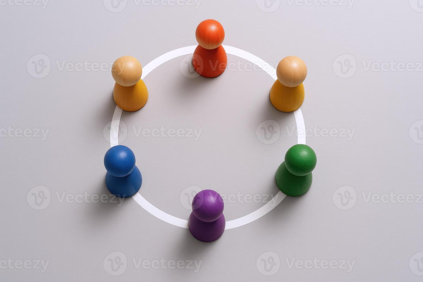 Teamwork Concept Colorful Wooden Figures Arranged in a Circle, Symbolizing Collaboration and Unity on Gray Background photo