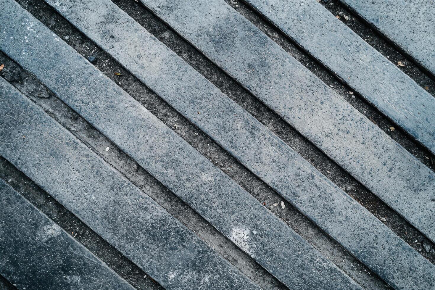 Textured concrete surface with diagonal patterns in urban setting photo