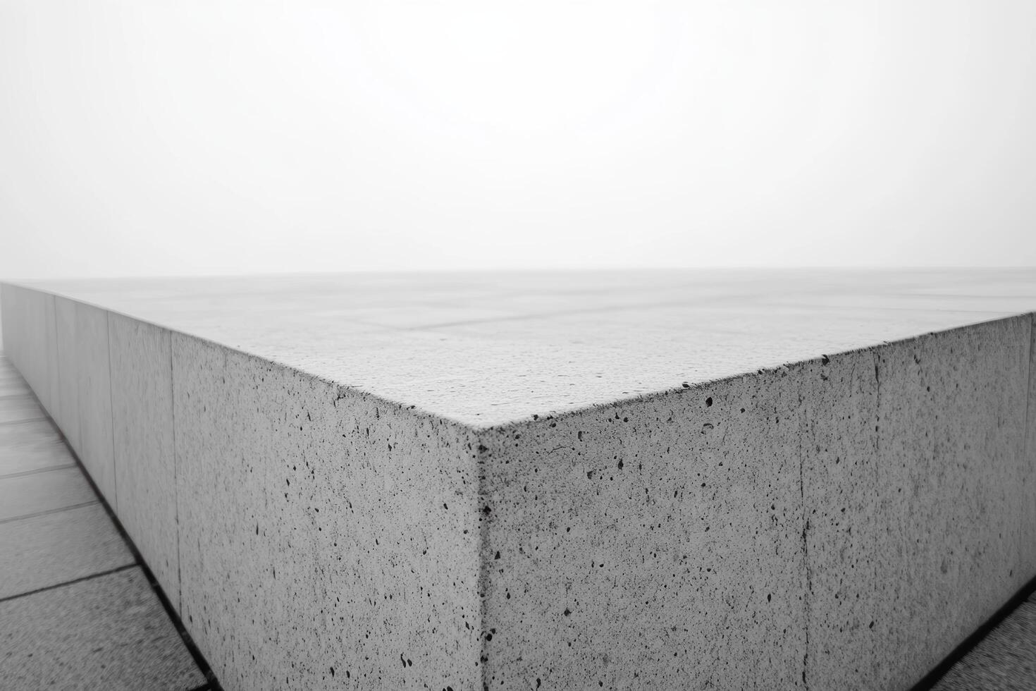 Monochromatic concrete structure with sharp angles in misty environment photo