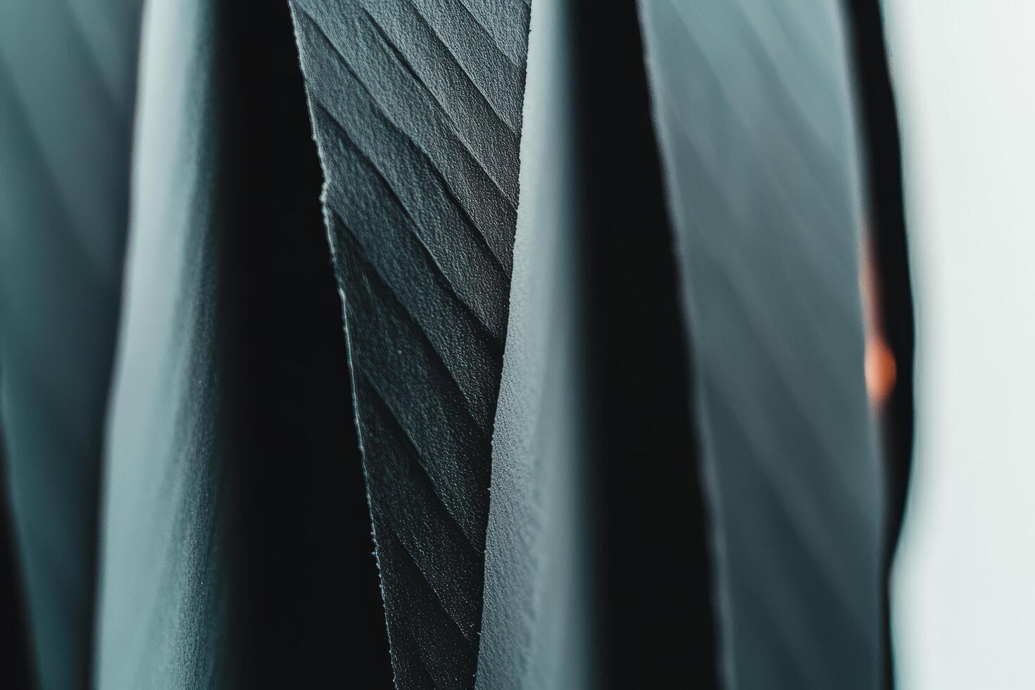 Close-up view of textured black fabric showcasing its unique patterns and folds photo