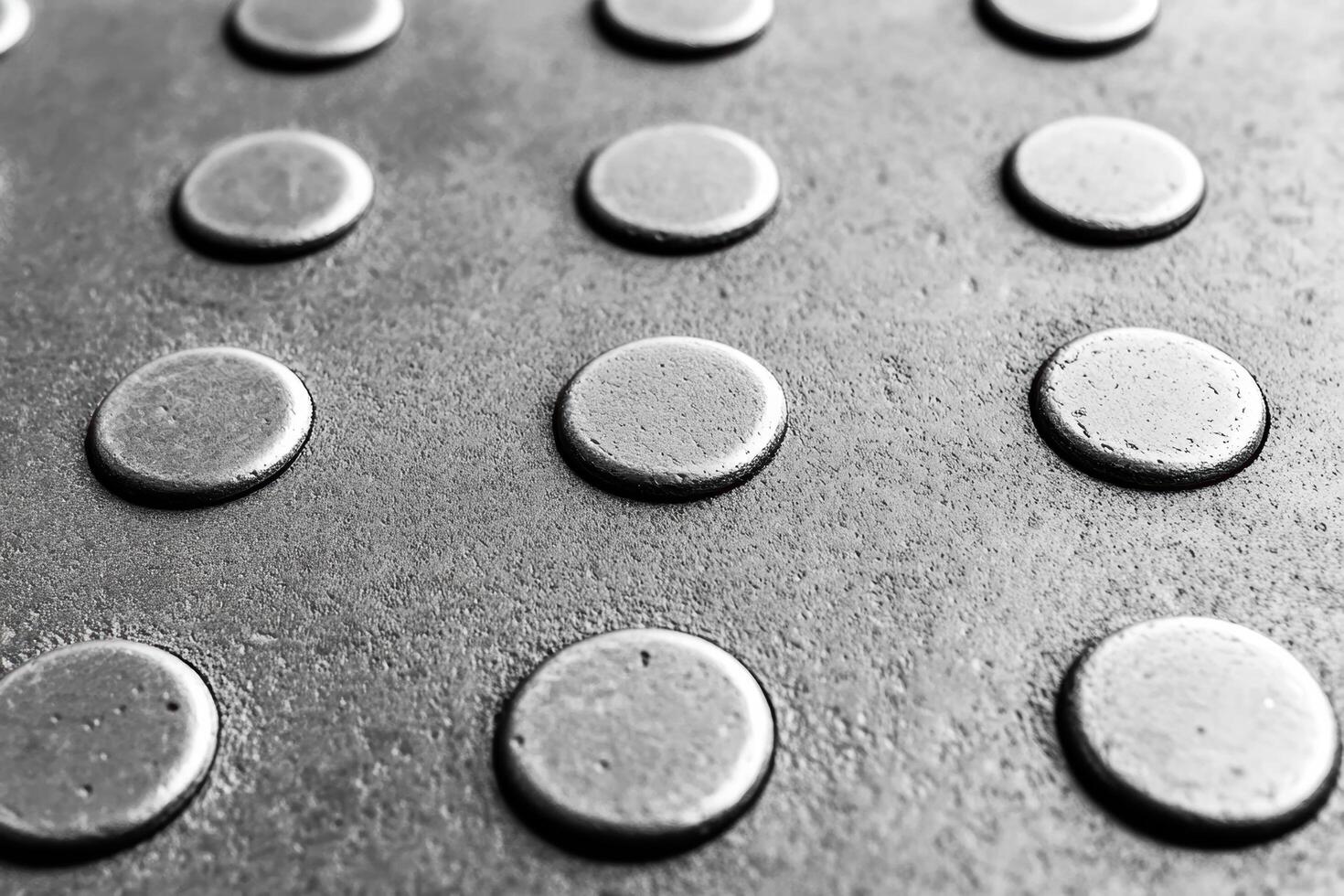 Metal surface with circular patterns in monochrome design photo