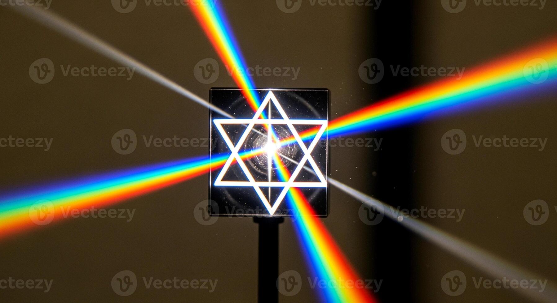 Light dispersion through a prism with a Star of David cutout, creating a rainbow effect. photo