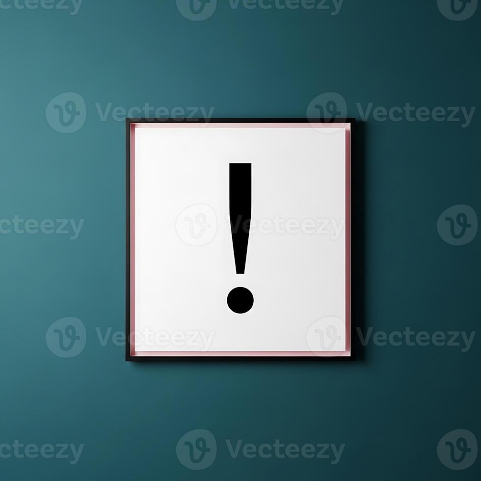A framed exclamation point on a teal wall creating a simple yet striking visual statement with contrast photo