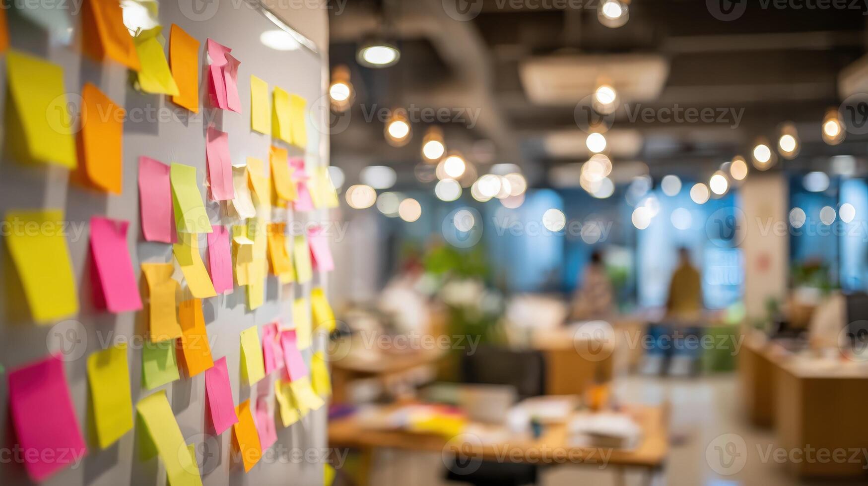 Brainstorming Session Colorful Sticky Notes Adhered to a Wall in a Modern, Collaborative Office Space photo