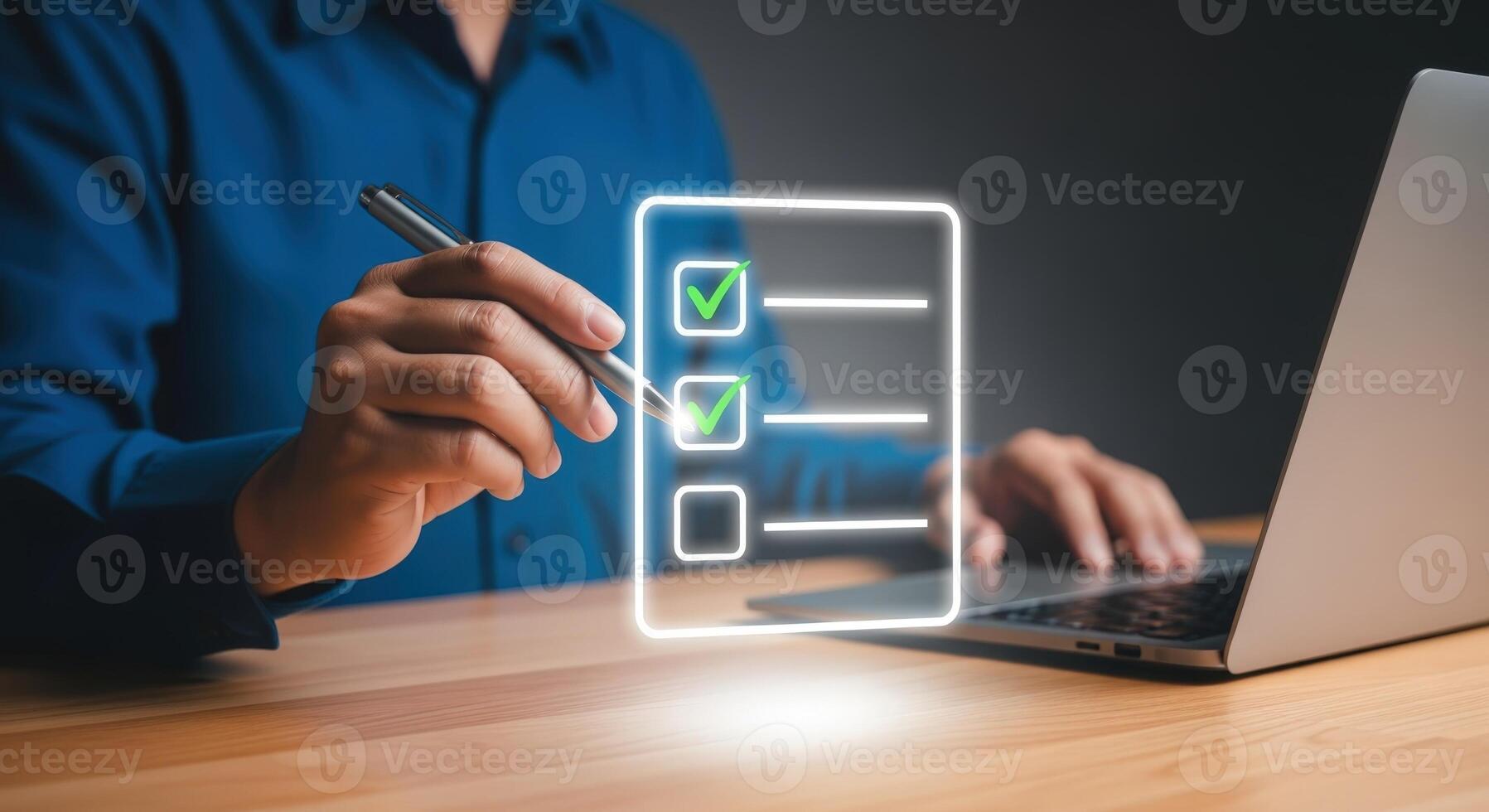 Digital checklist concept with a person using a laptop and stylus, demonstrating task completion photo