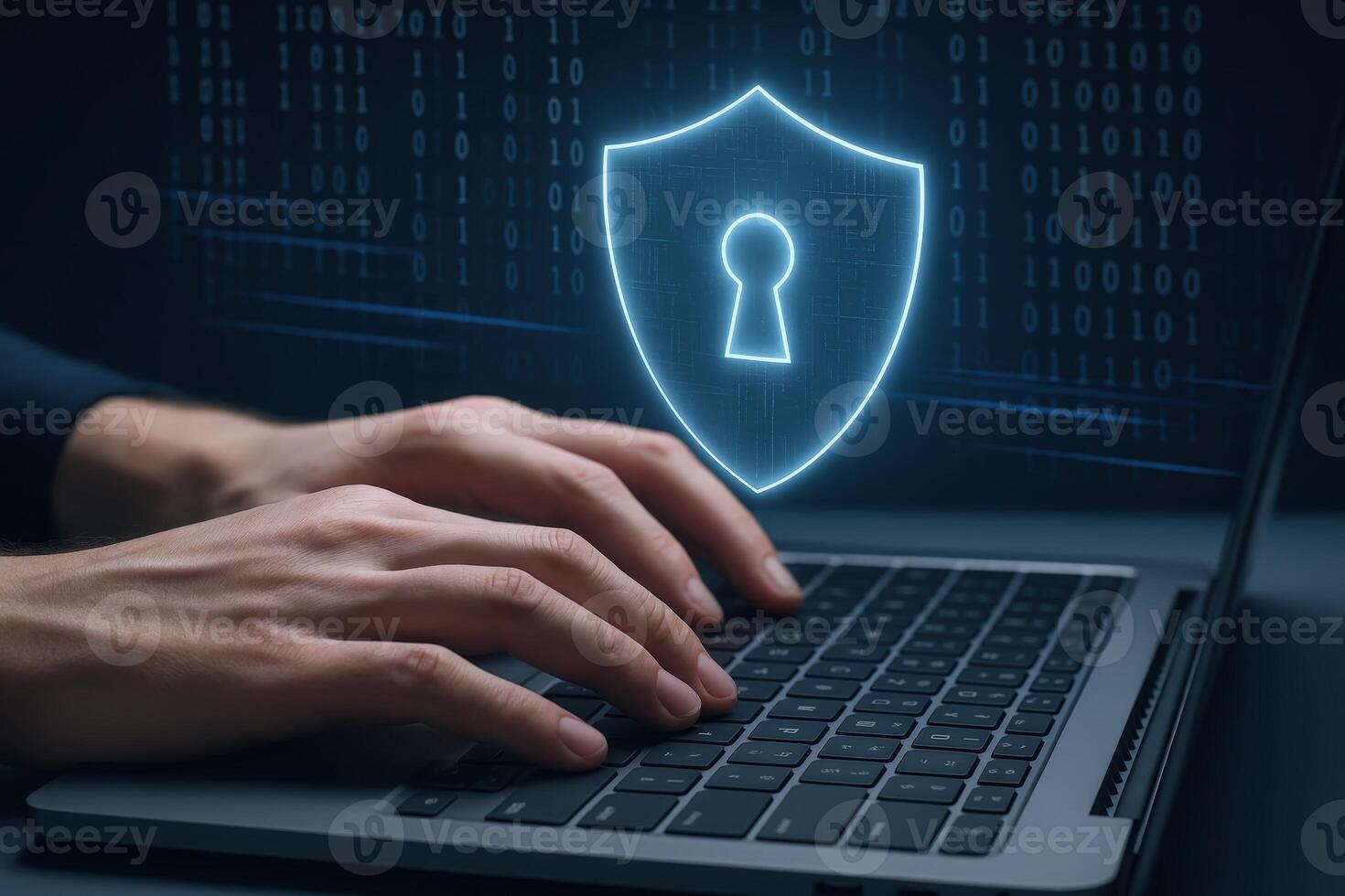 Cybersecurity Professional Working on Laptop with Shield Icon for Data Protection and System Security photo