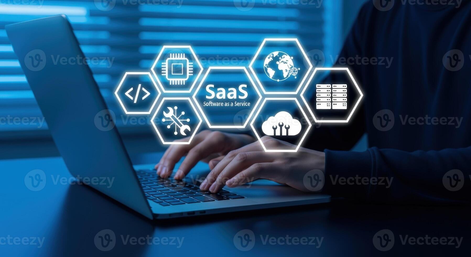 Software as a Service Concept Man Using Laptop with SaaS Icons Overlayed, Representing Cloud Computing and Business Solutions photo