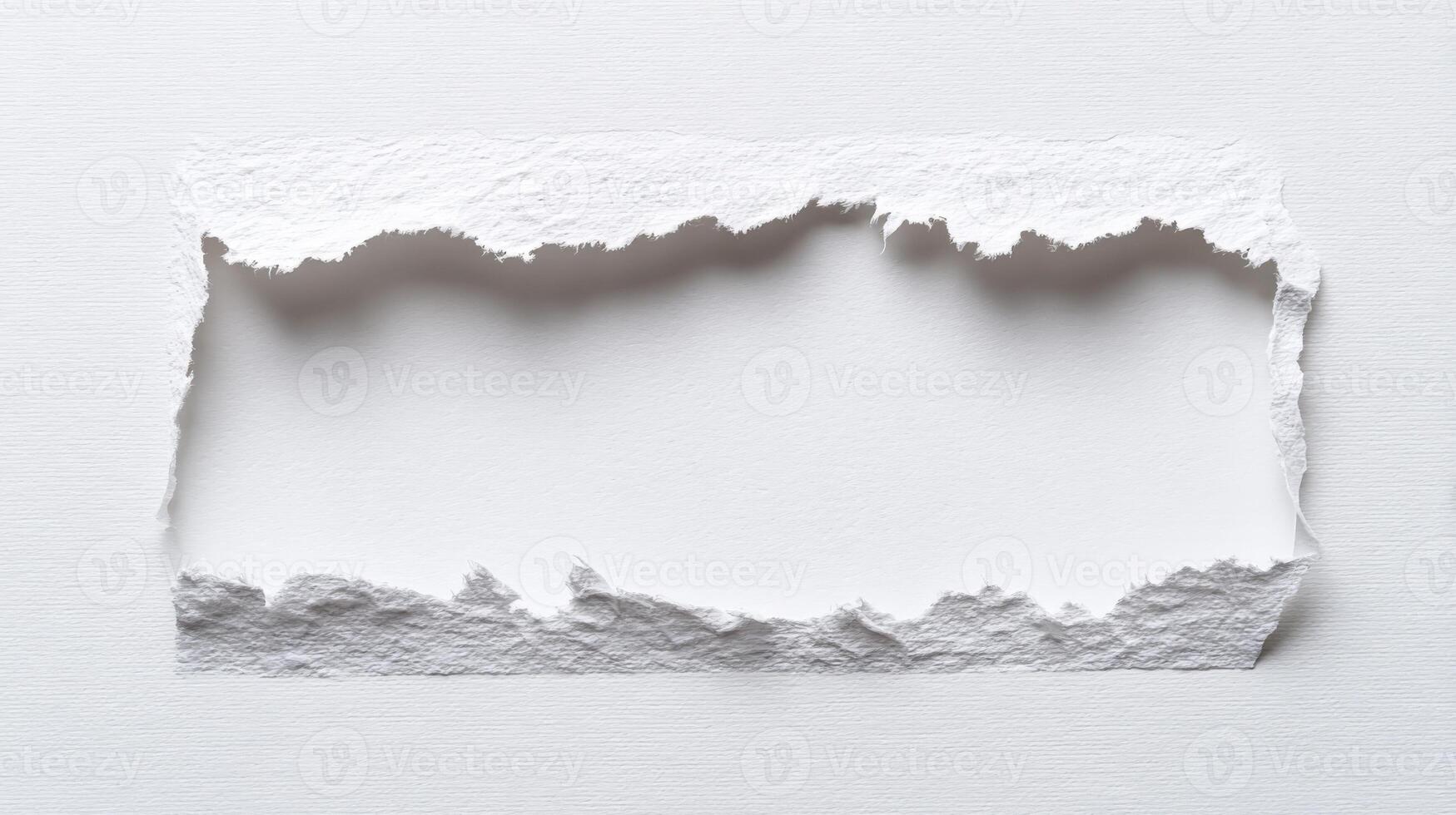 Torn Paper Frame Revealing White Space, Emphasizing Texture and Simplicity for Creative Design Projects photo