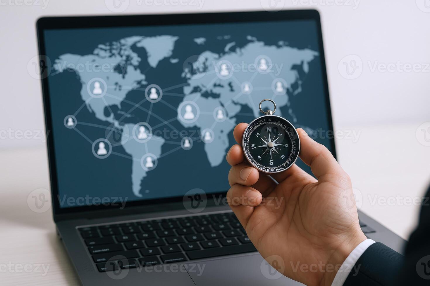 Global Network Navigation Hand Holding Compass with World Map on Laptop Screen Display photo