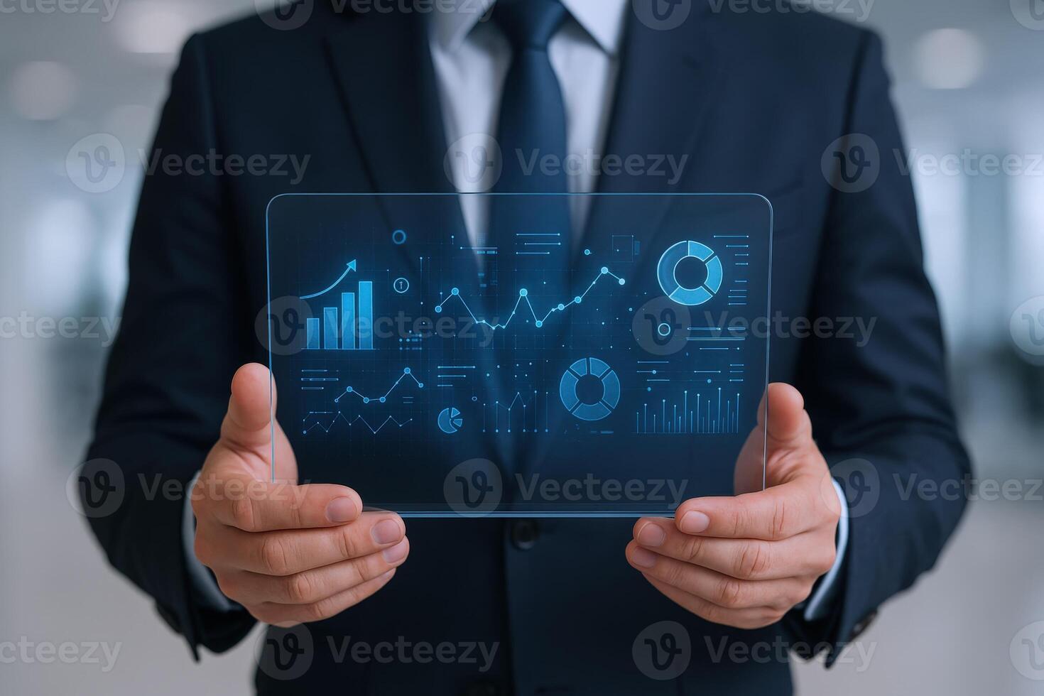 Businessman Analyzing Digital Financial Data, Holding Transparent Interface with Charts and Graphs, Future Technology photo