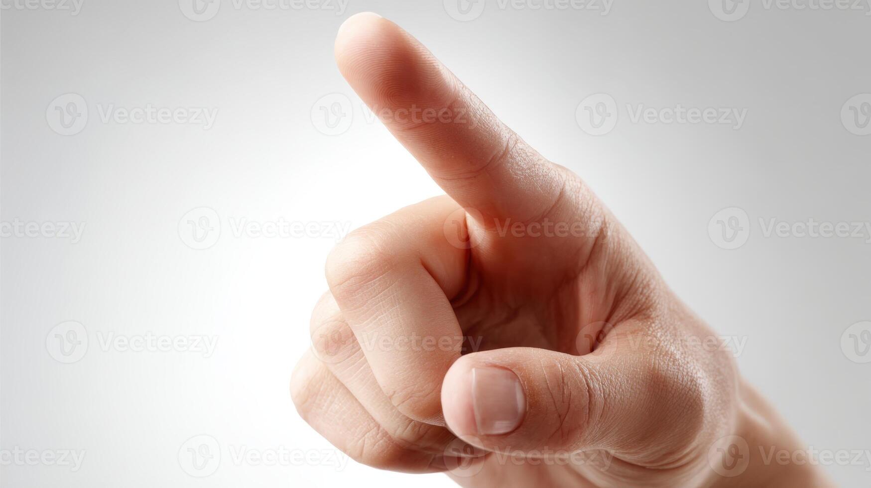 Human hand pointing upwards with index finger, representing direction, selection, choosing or attention on white background photo