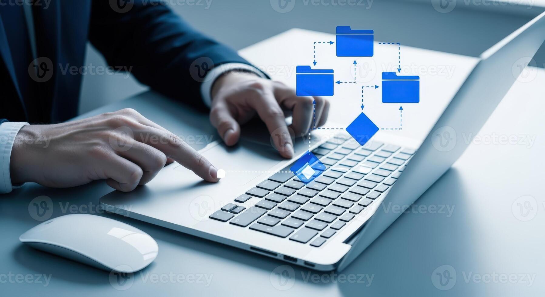 Business professional using a laptop displaying a flowchart, demonstrating process management and data organization in modern office photo