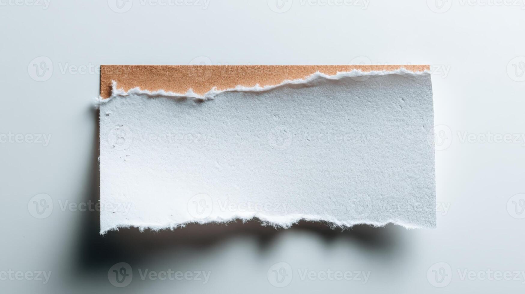 Torn Paper Edge Reveals a Neutral Background, Ideal for Text Overlays and Mockups photo