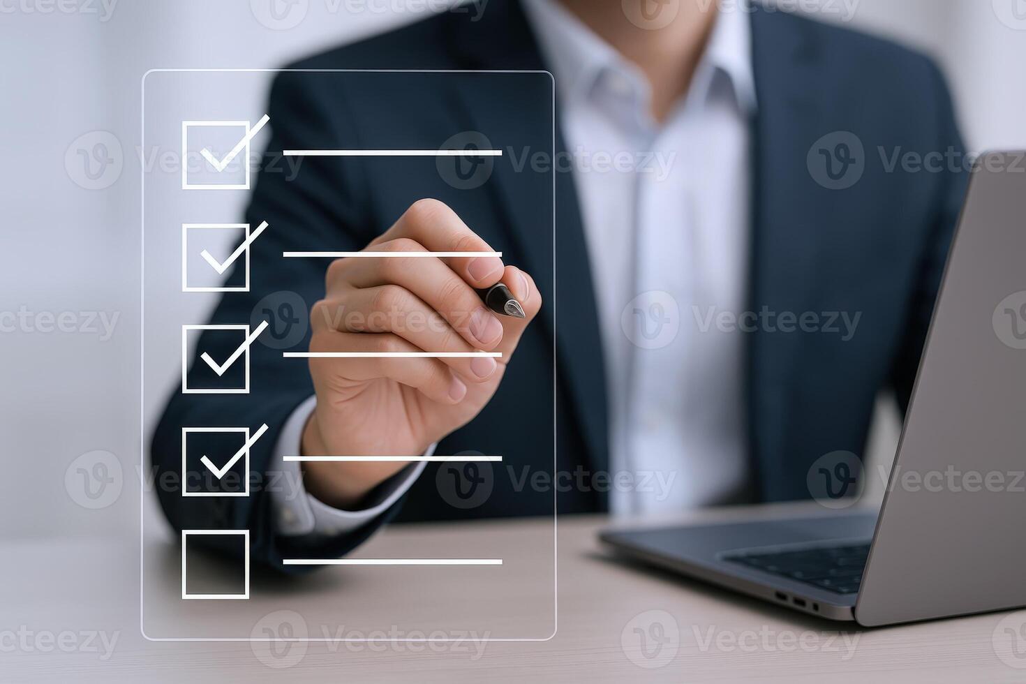 Professional Man Completing Checklist on Transparent Screen with Laptop in Office Setting for Business Task photo