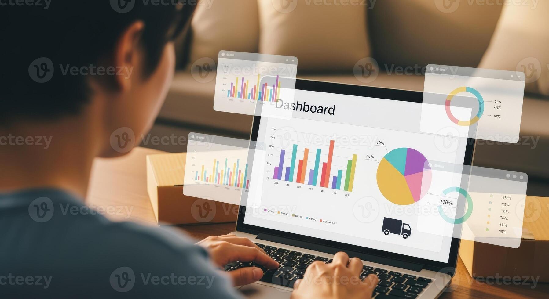 Person Analyzing Data on Laptop with Graphic Overlays for Business and E-Commerce Analytics photo