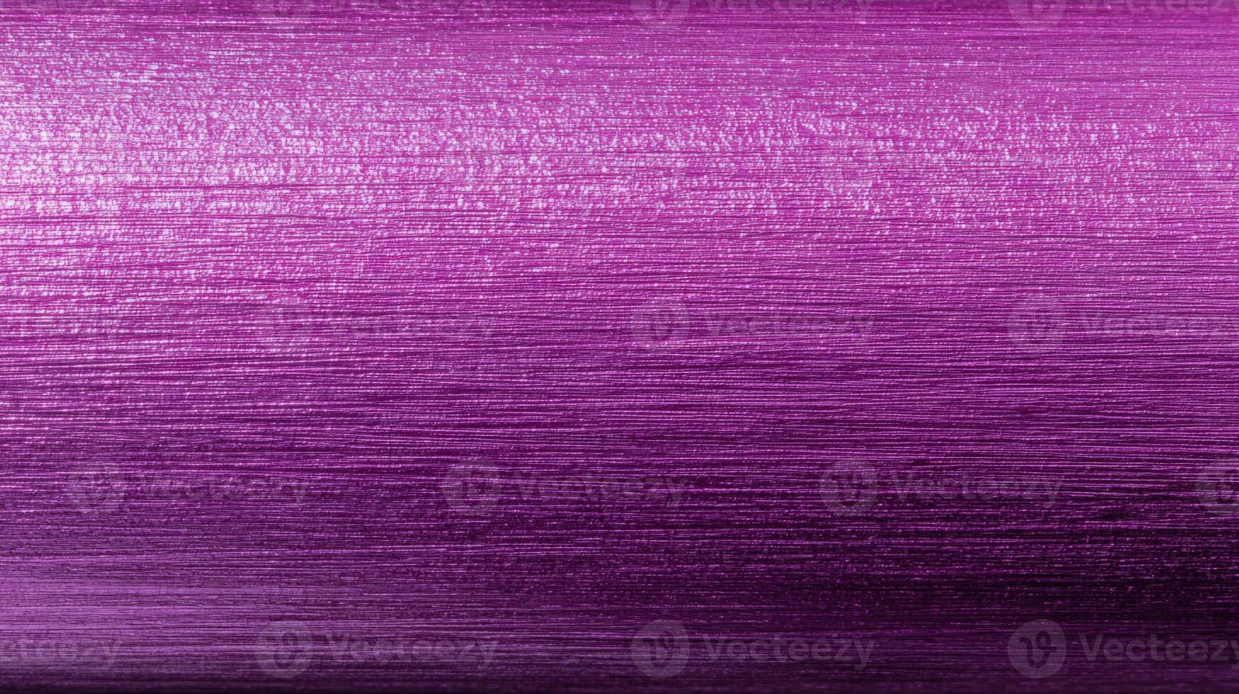 Close-up of Textured Purple Metallic Surface Showing Gradient and Linear Pattern for Backgrounds or Design Elements photo