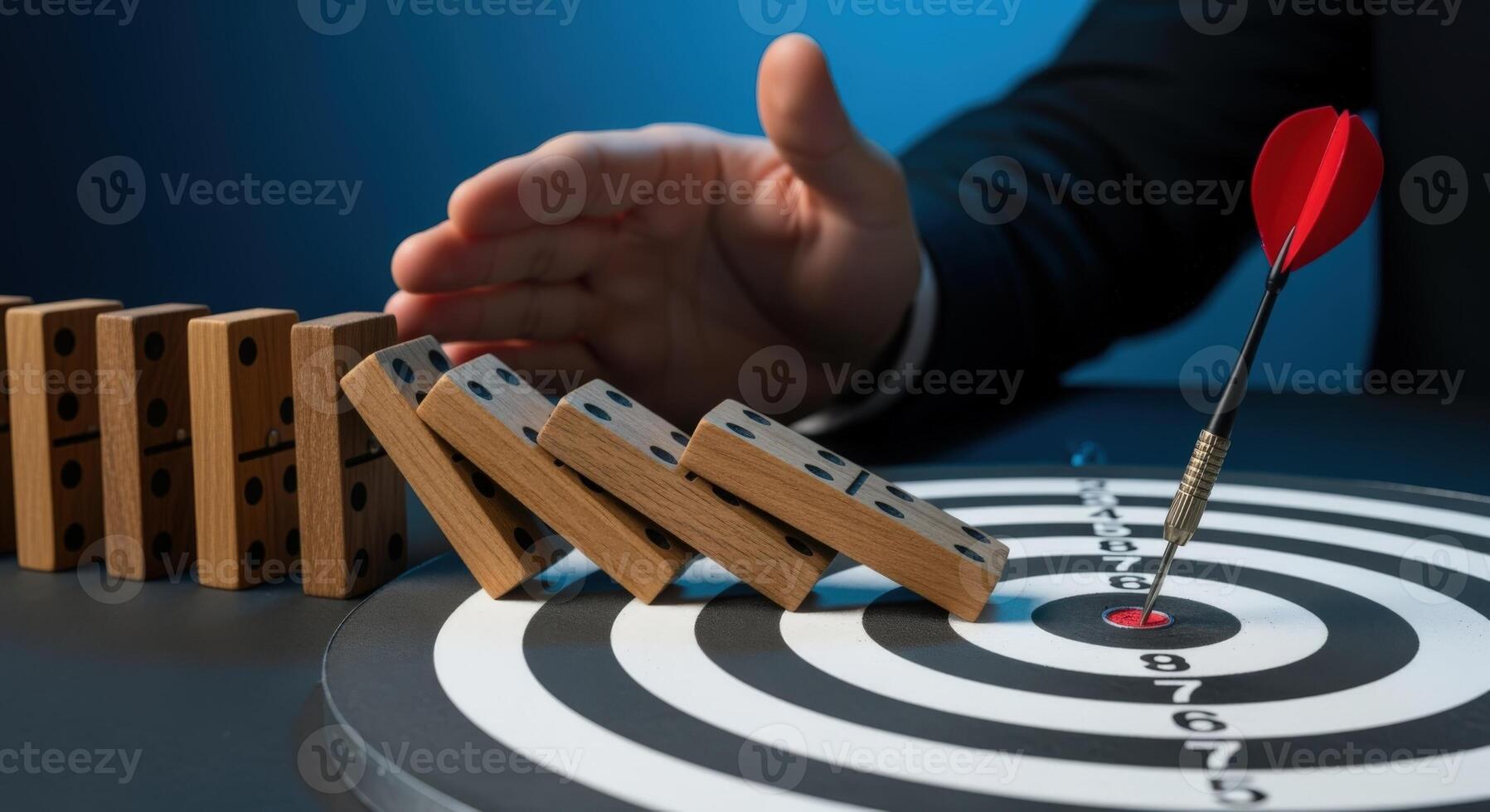 Domino Effect Interruption with Dart Hitting Bullseye, Risk Management and Strategy Implementation, Problem Solving photo