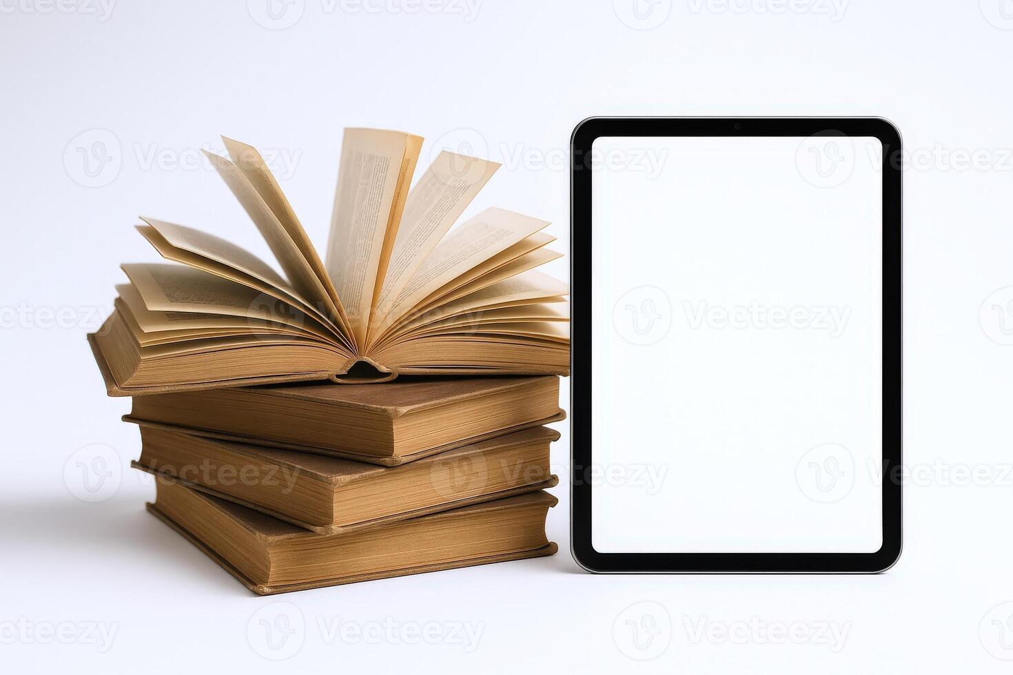 Stack of Antique Books with Open Pages and Blank Screen Tablet on a Clean Background photo