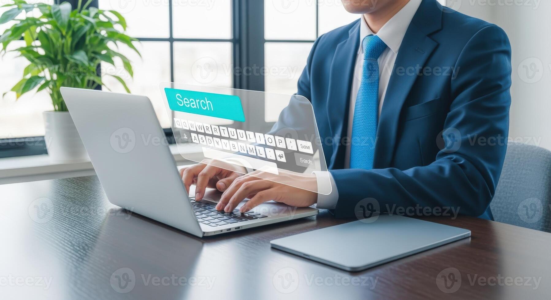 Businessman Typing on Laptop with Search Bar Interface Overlay for Online Information Access and Connectivity photo