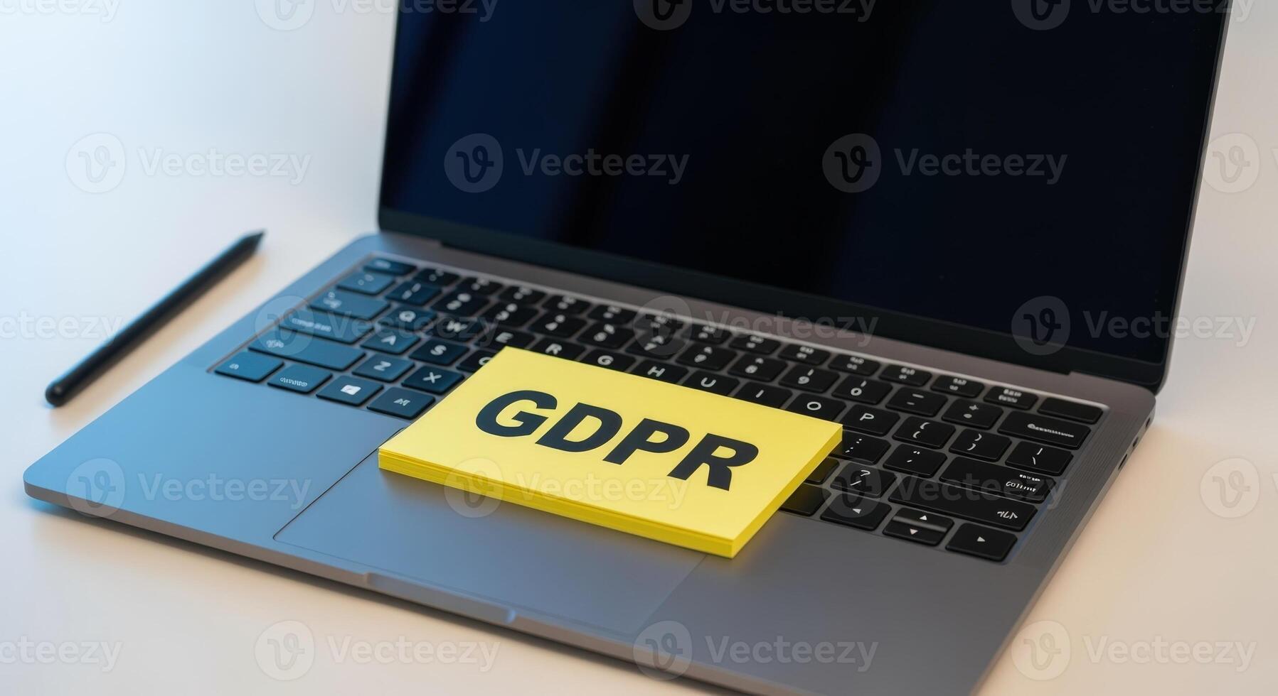 Laptop Displaying GDPR Message on Sticky Note, Representing Data Protection and Regulatory Compliance photo