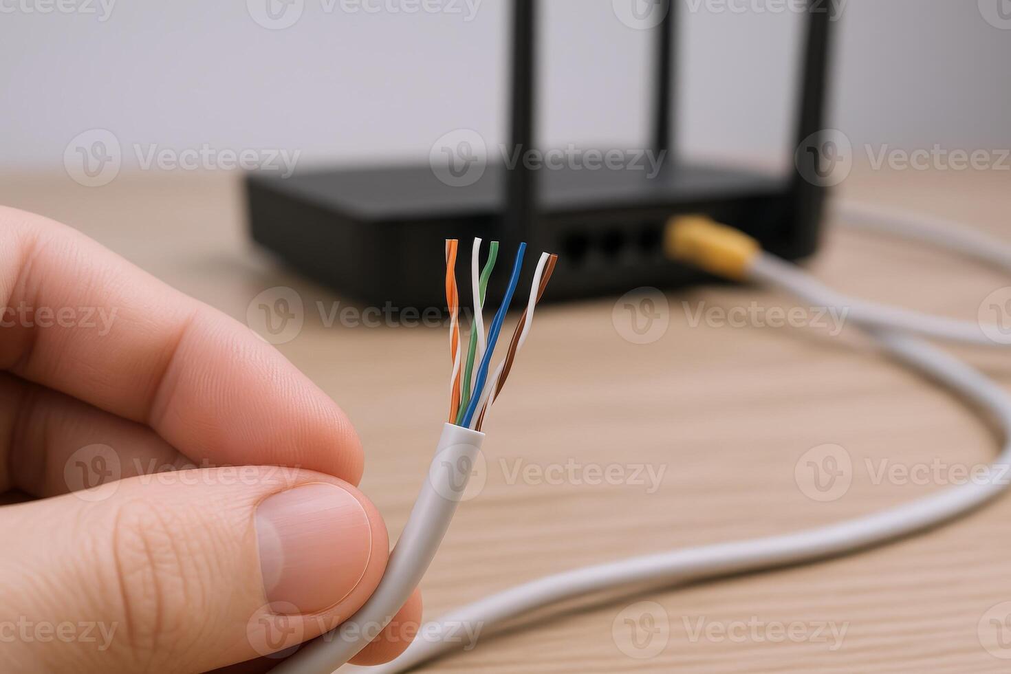 Ethernet Cable with Exposed Wires Connecting to Router for Network Connection and Data Transmission photo