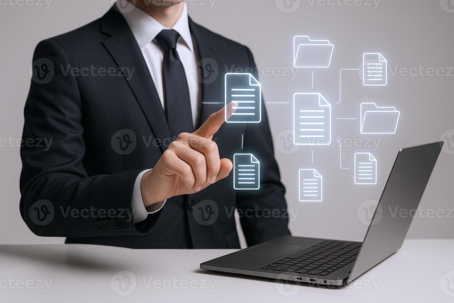 Document Management System Businessman Interacting with Digital Files on Laptop for Efficient Workflow photo