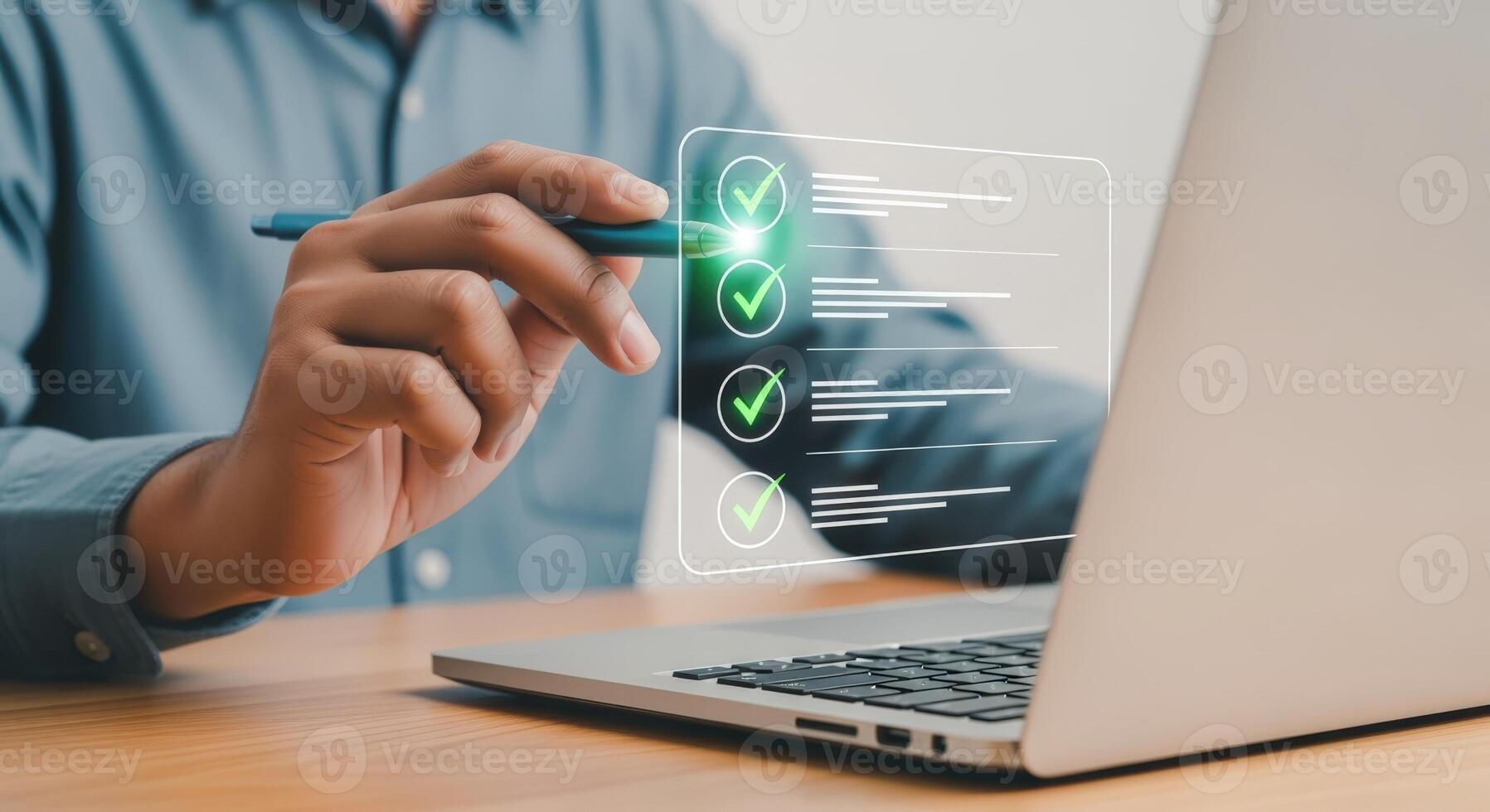 Man completing digital checklist on laptop, emphasizing efficiency, productivity, and task management in modern workflow photo