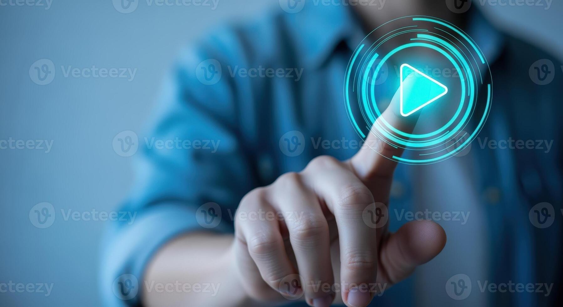 Digital Engagement Man Interacting with Play Button on Virtual Interface, Symbolizing Connectivity and Modern Technology photo