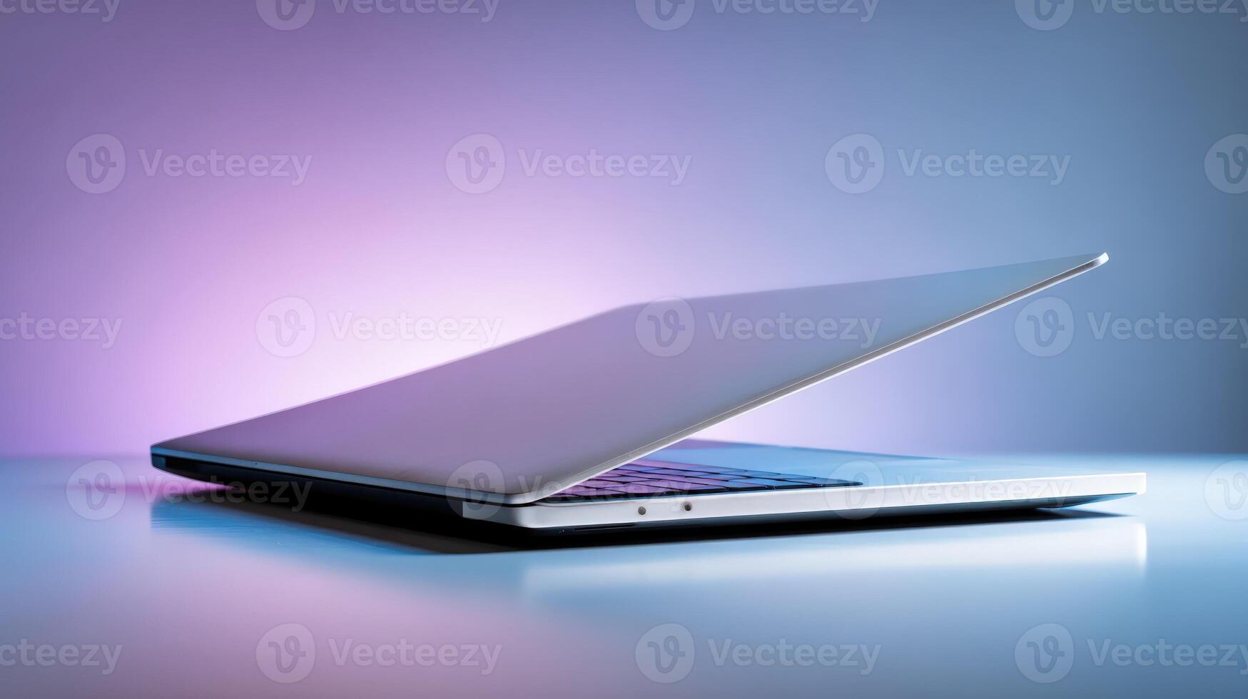 Sleek Laptop Computer Displaying Modern Technology and Design with a Clean Minimalist Aesthetic Against Gradient Background photo