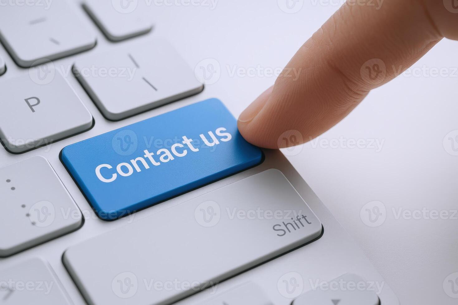 Reaching Out Finger Pressing Contact Us Button on Keyboard for Communication and Support photo