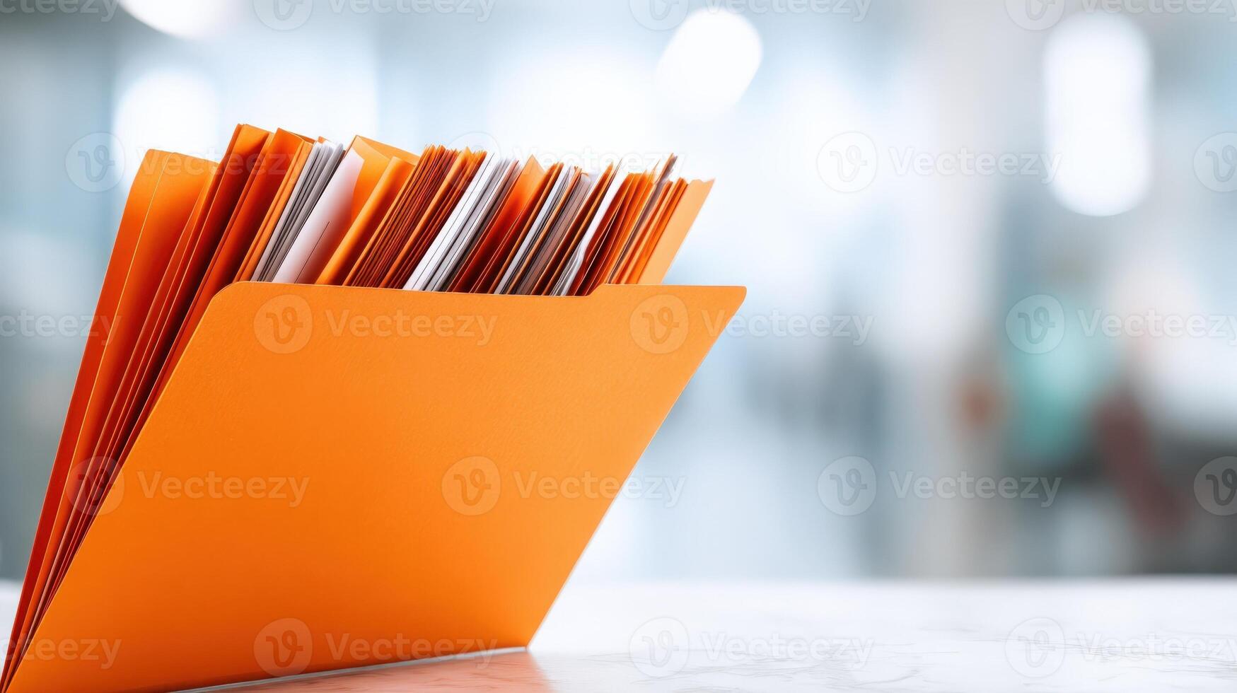 Open Orange File Folder with Documents on a Desk in an Office Setting, Copy Space photo