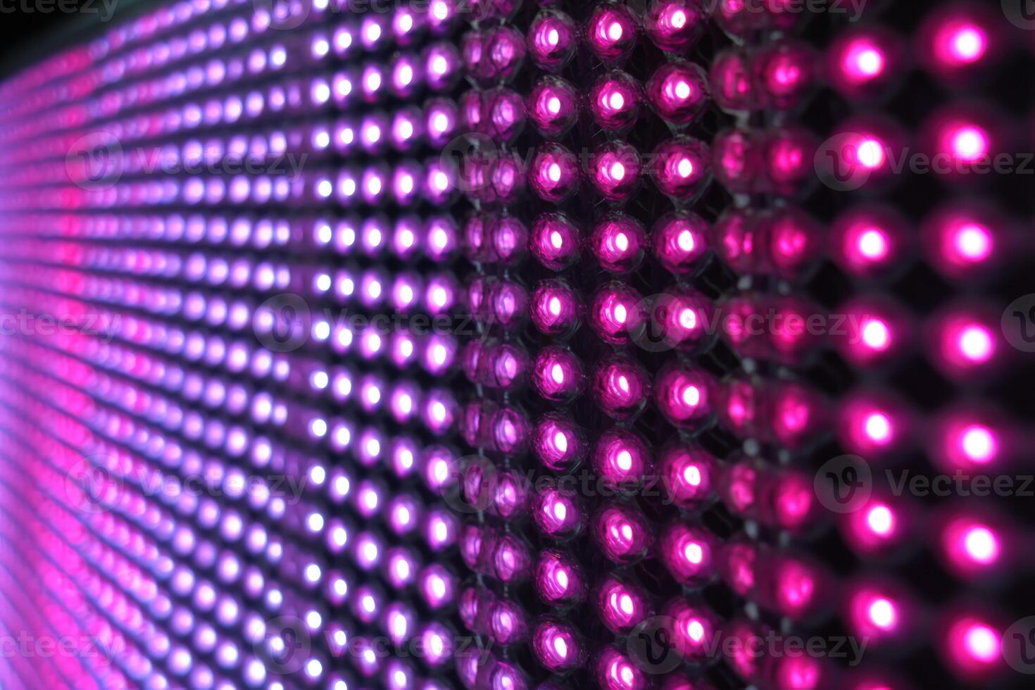 Close-up of a Bright LED Display Panel Showing Pink Color, Offering Vibrant Visuals and Modern Technology photo