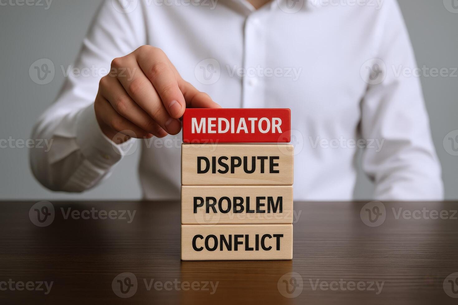 Mediator Resolving Dispute Wooden Blocks Depicting Conflict Resolution, Problem Solving, and Impartial Negotiation by a Mediator photo