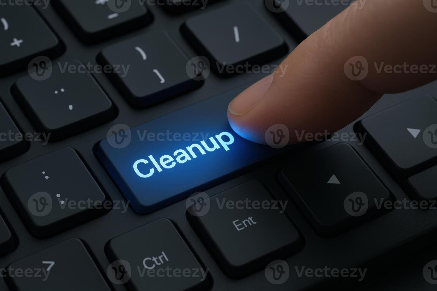 Finger pressing cleanup button on computer keyboard, concept for system maintenance and optimization photo