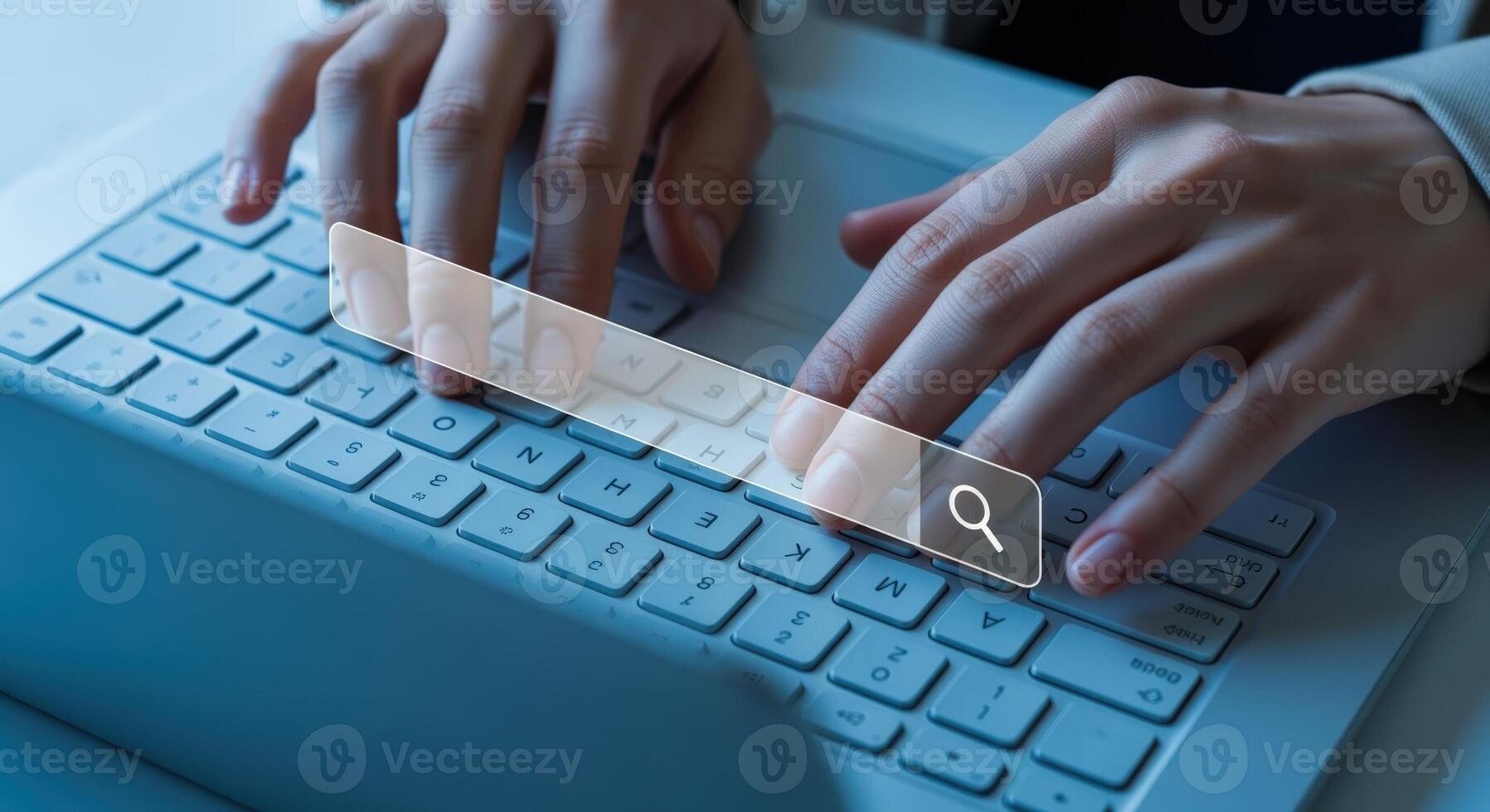 Hands Typing on Laptop Keyboard with Search Bar Overlay for Online Information Access photo