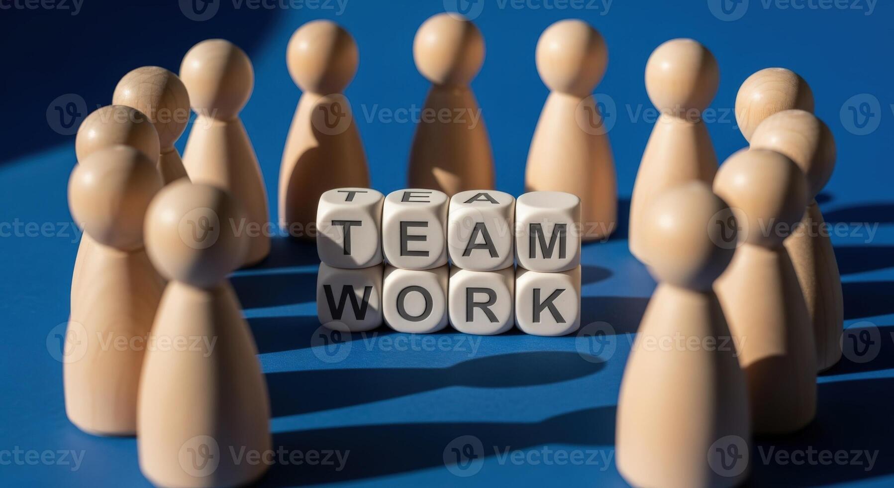 Teamwork Concept with Wooden Figures Surrounding Blocks Spelling Teamwork, Representing Collaboration and Unity photo