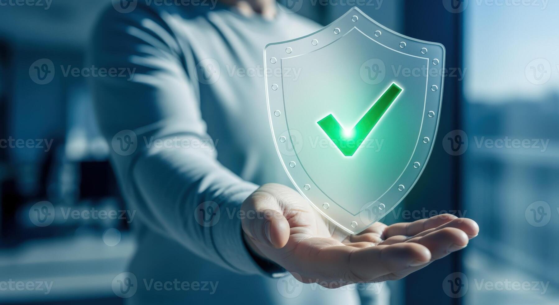 Conceptual Image of Security Shield with Check Mark in a Mans Hand, Representing Data Protection photo