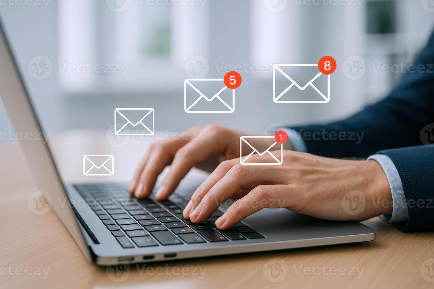 Businessman typing on laptop with email notifications illustrating communication technology and inbox management photo