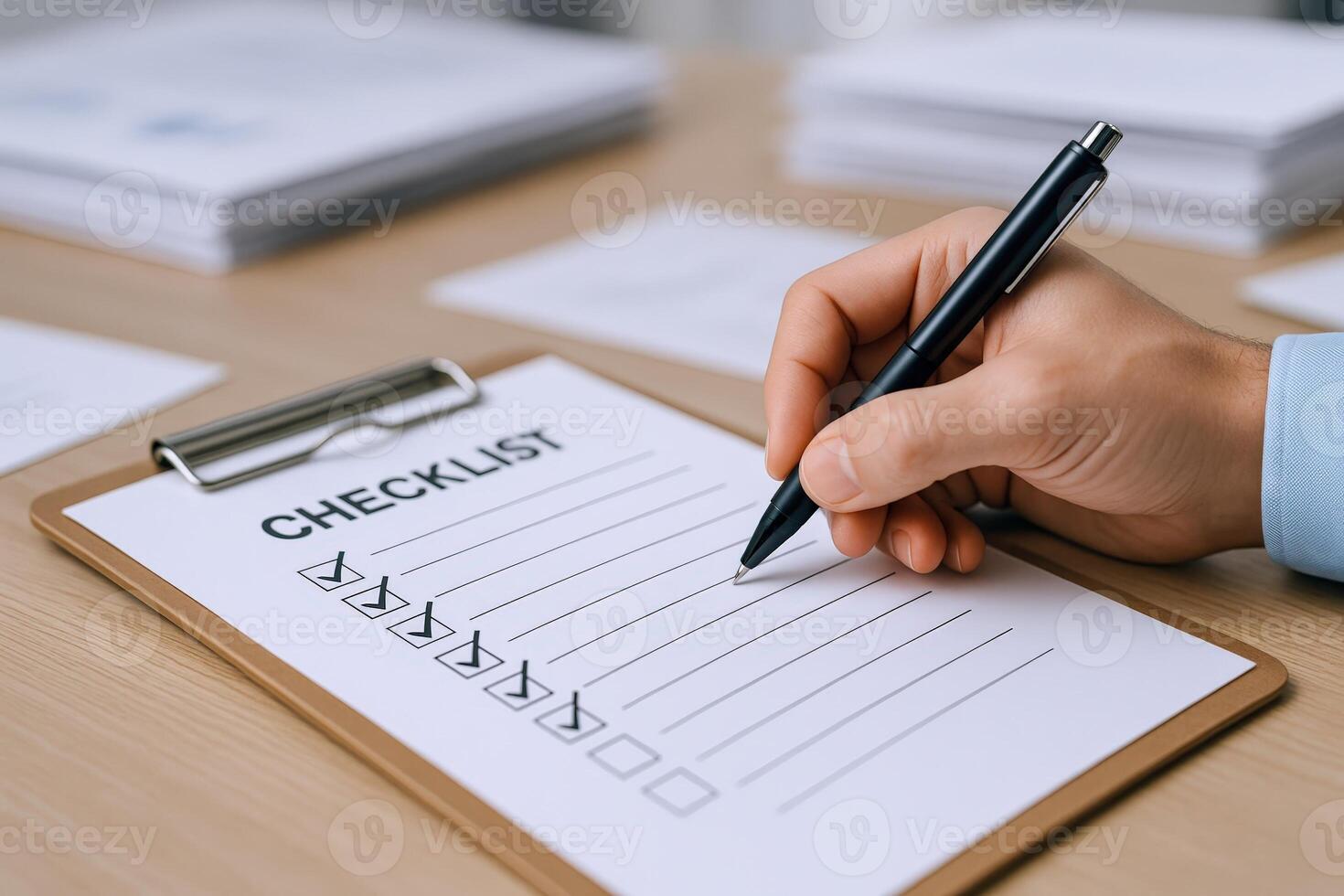 Completing Checklist with Pen on Clipboard for Project Management and Task Completion in Office Setting photo