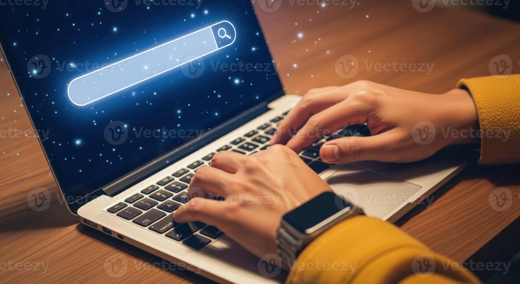 Searching the Internet on a Laptop Hands Typing with Search Bar Graphic Overlay on Screen photo