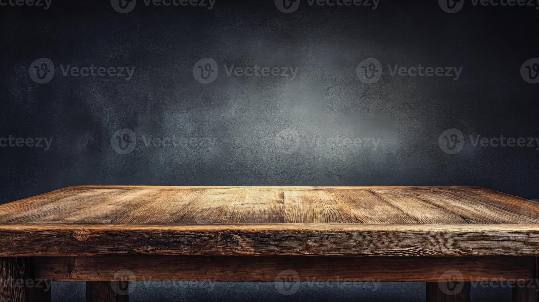 Empty Rustic Wooden Table Surface Against Dark Textured Wall Background for Product Mockup or Display photo