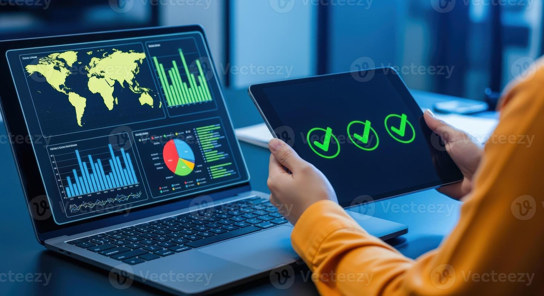 Business Analytics Dashboard on Laptop with Tablet Displaying Approval Icons for Data Visualization photo