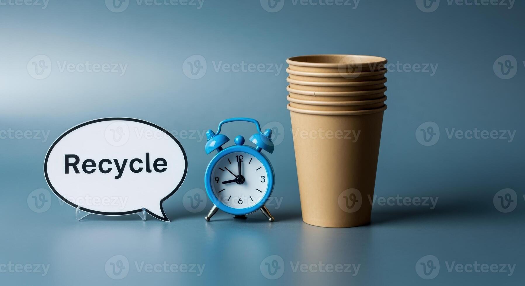 Recycle Reminder Stack of Disposable Cups with a Clock and Speech Bubble on Gray Background photo